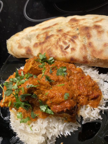 Homemade chicken tikka masala and garlic flatbread