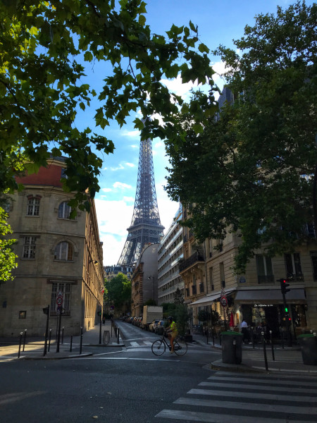 A street with a sudden view of the Eiffel Tower