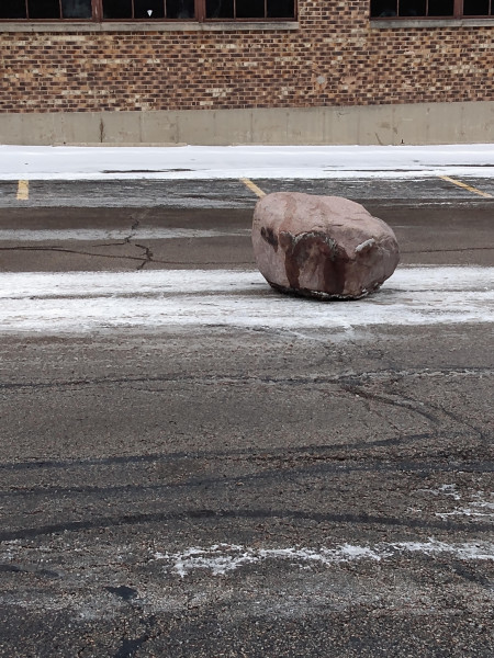 A large boulder appeared in our parking lot over the weekend