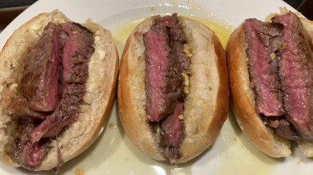 Garlic butter-drenched ribeye steak mini baguettes