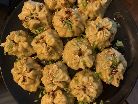 Curried beef dumplings in sesame chilli oil