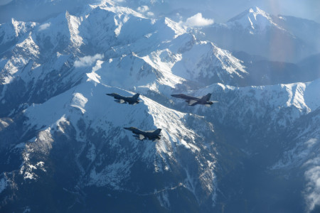 US navy F/A-18E Super Hornet and two Greek F-16s fly over Greece during combined long range strike training, Feb. 22, 2023