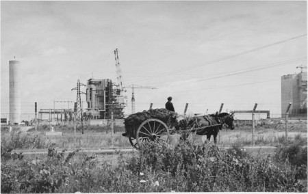 France, 1962: a horse-drawn cart in front of the Chinon nuclear power plant under construction