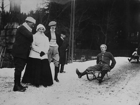 Richard Strauss attempts to ride a sled. Late 1900s