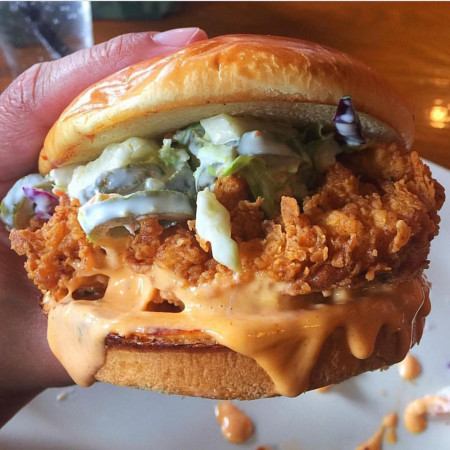 Buttermilk fried chicken sandwich with jalapeno coleslaw on a brioche roll