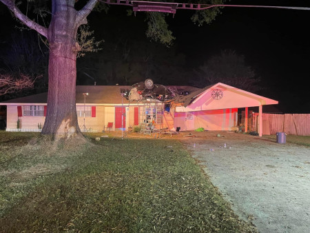 In Zachary, Louisiana a car ended up on the roof of this house…