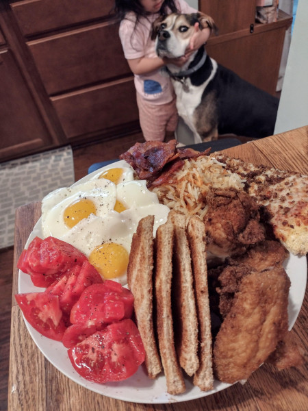 Eggs, bacon, hash browns, pizza, fried chicken, toast, and tomatoes