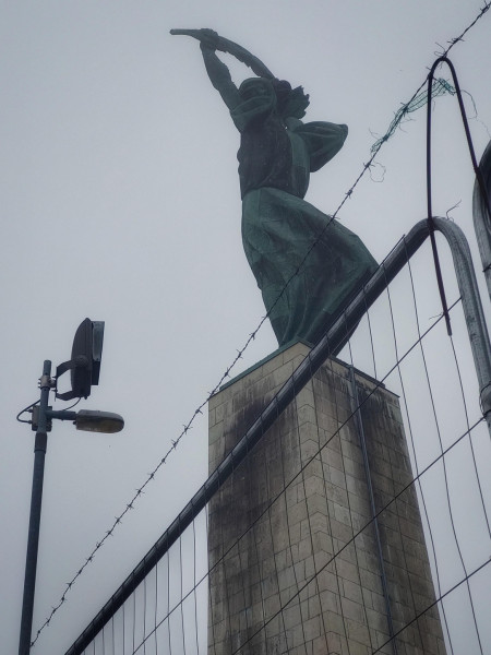 The hungarian Statue of Liberty (Budapest) encased in barbed wire and searchlights