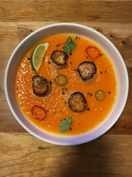 Seared scallops with carrot purée, Serrano peppers, cilantro, lime