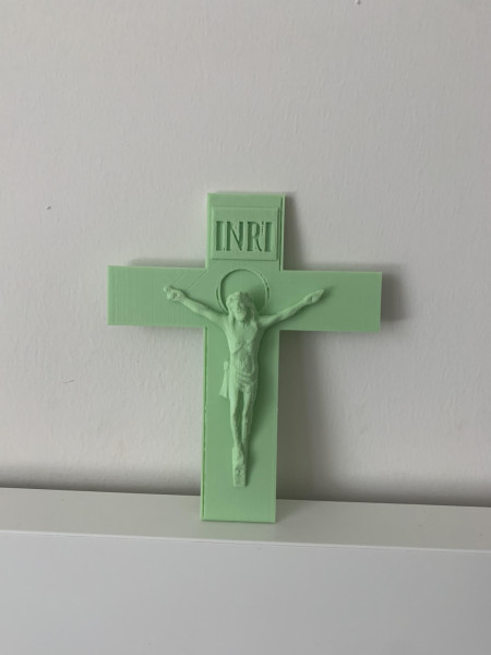 The crucifix symbolizes the sacrifice of Jesus