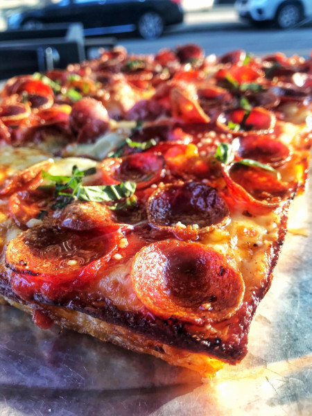 Hot honey, pepperoni, and basil Detroit style pizza