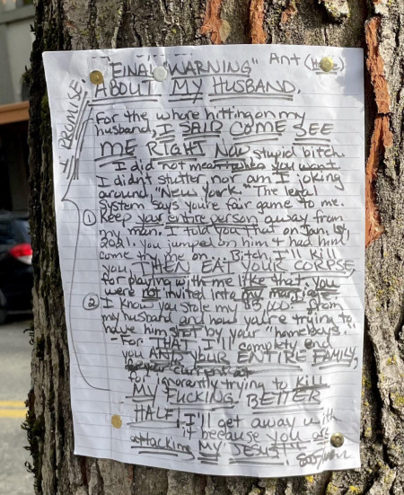 pinned to a tree at a crosswalk