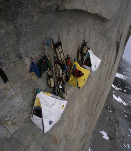 Climbers sleeping on a side of a cliff