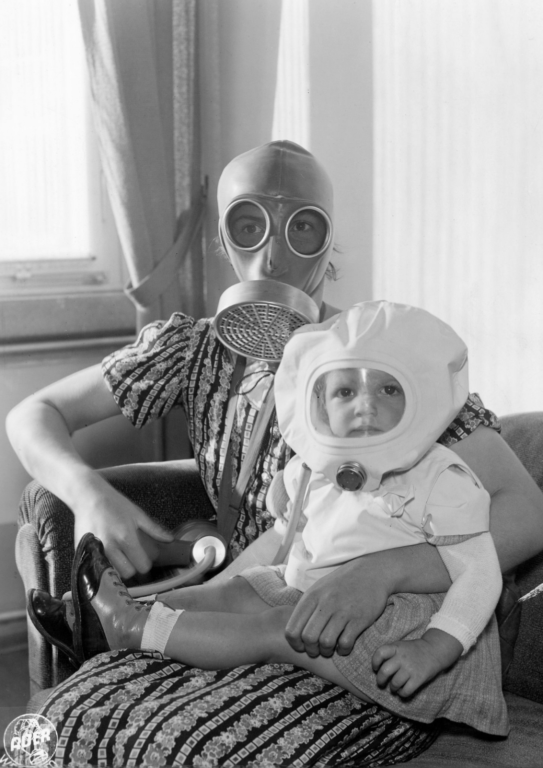 Mother and child wearing gas masks, Germany, 1937 ca