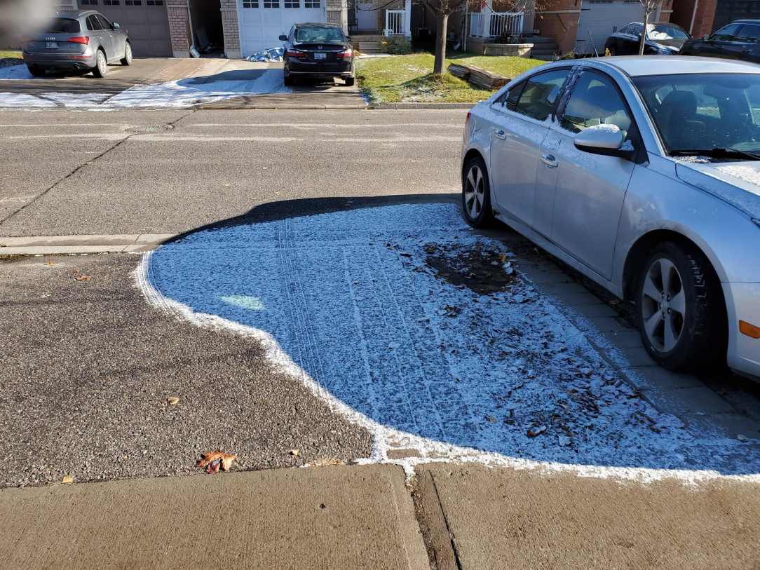 The way the snow is melted around the shadow