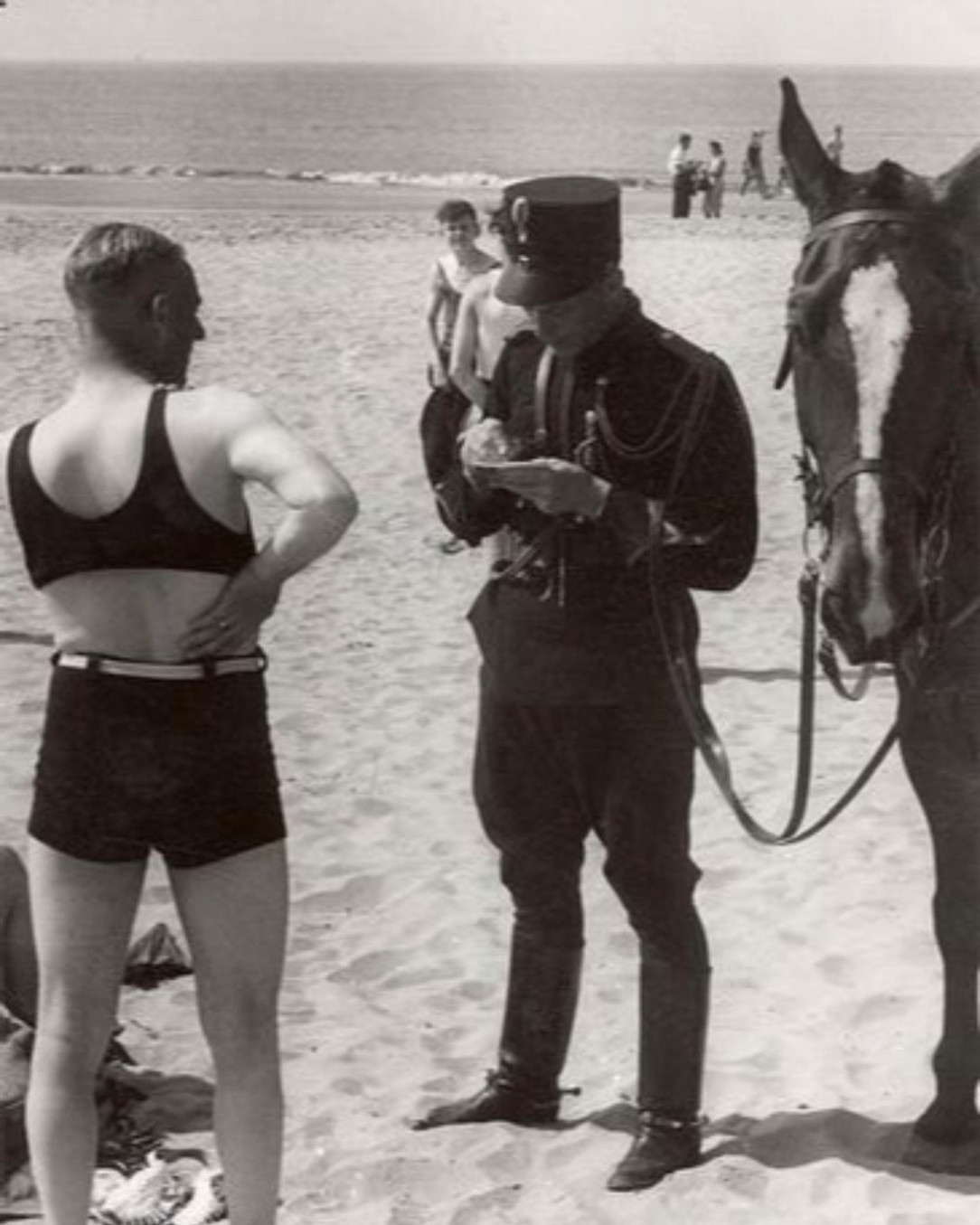 1931, Netherlands. A man is being fined for wearing indecent swimwear