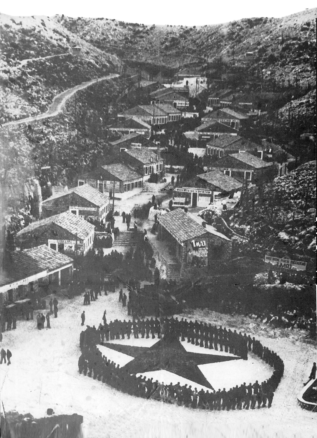 Inmates form a circle around a red star. Goli otok labor camp and prison for political dissidents, Yugoslavia, ca 1950