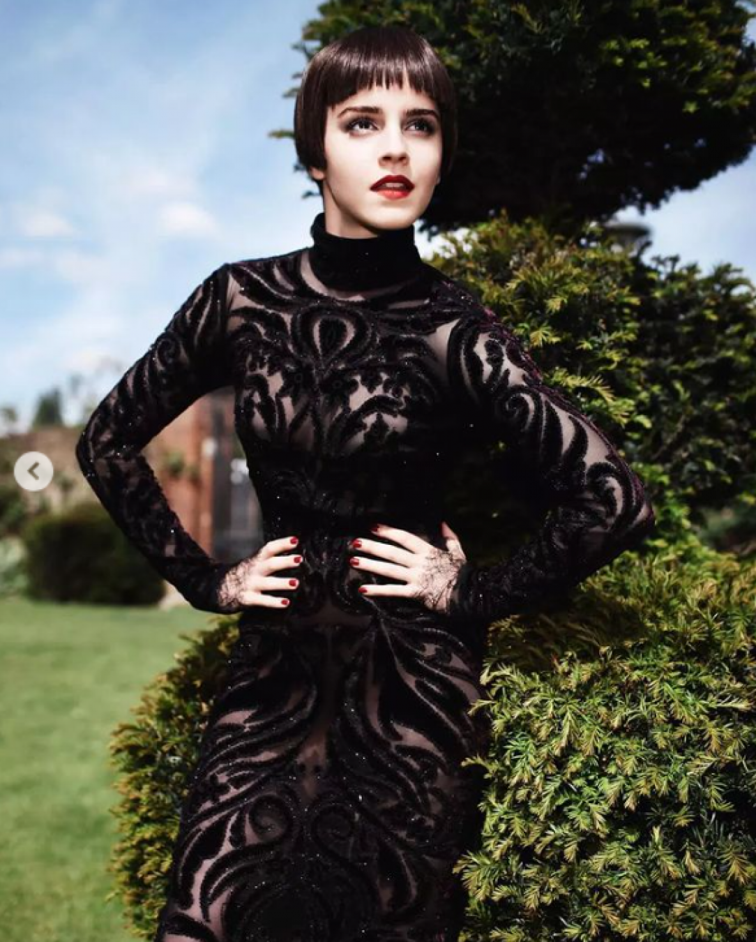 Emma in a black sheer dress