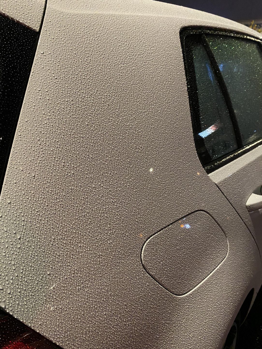 How the rain settled on car paint and looks like stucco