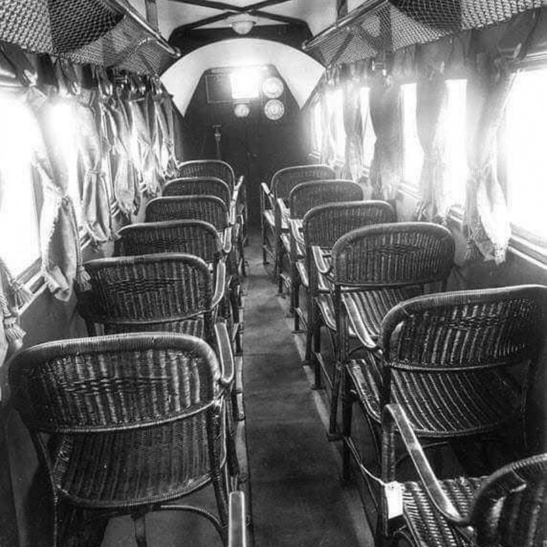 An interior photo of a passenger plane in 1930