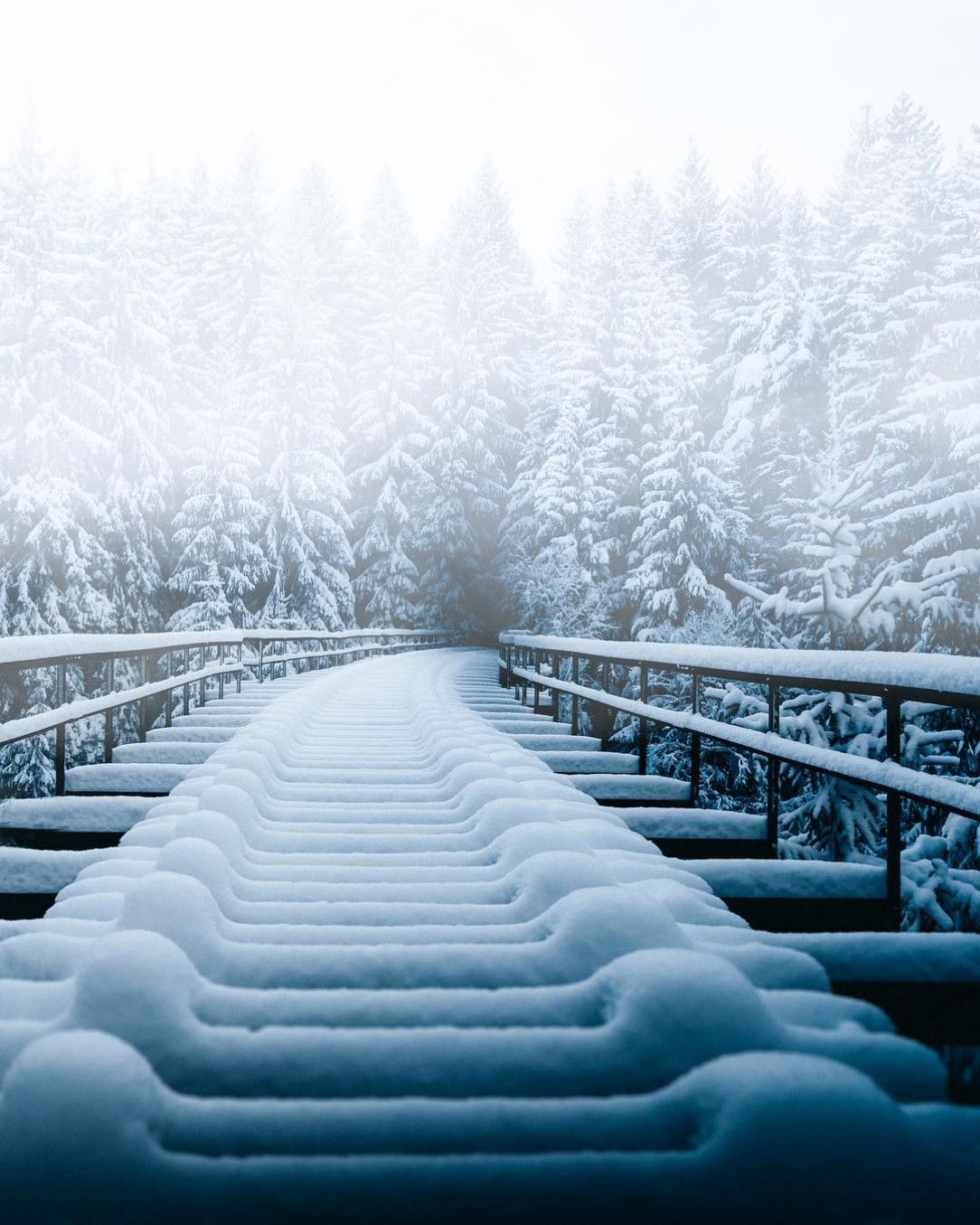 The snowfall on this train trestle