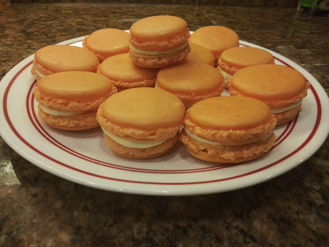 Made a perfect batch of orange creamsicle macarons. None of them cracked I&#039;m so hyped