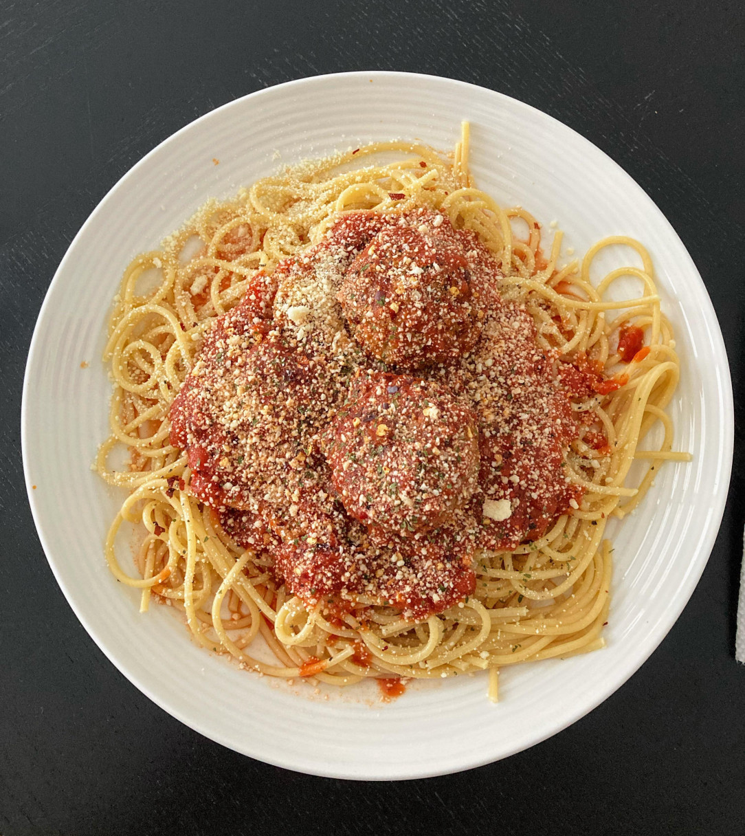 Spaghetti and meatballs with molto parmigiana