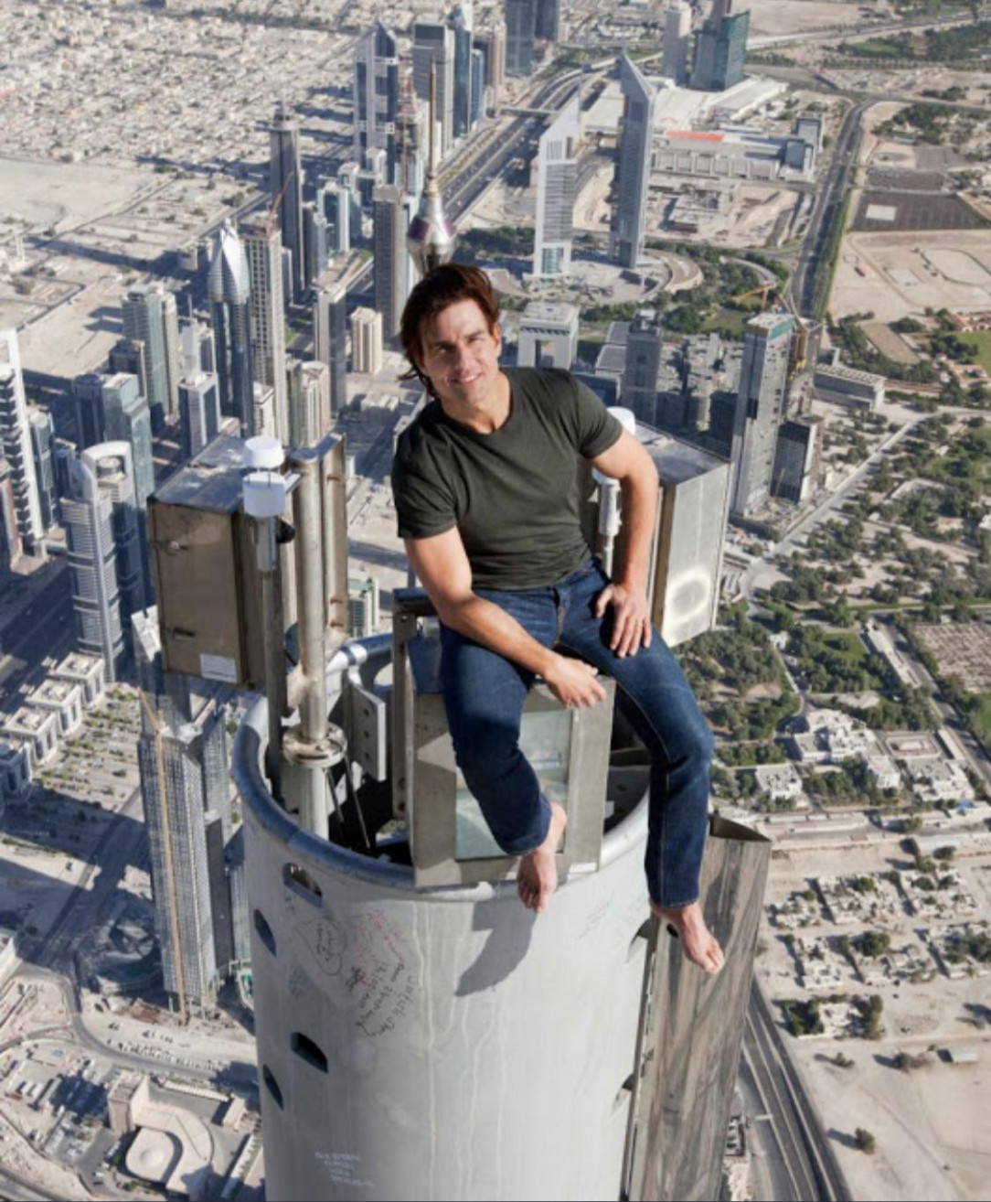 Tom Cruise sitting on top of the Burj Khalifa, without a harness of any kind, during filming of Mission Impossible: Ghost Protocol, 2011