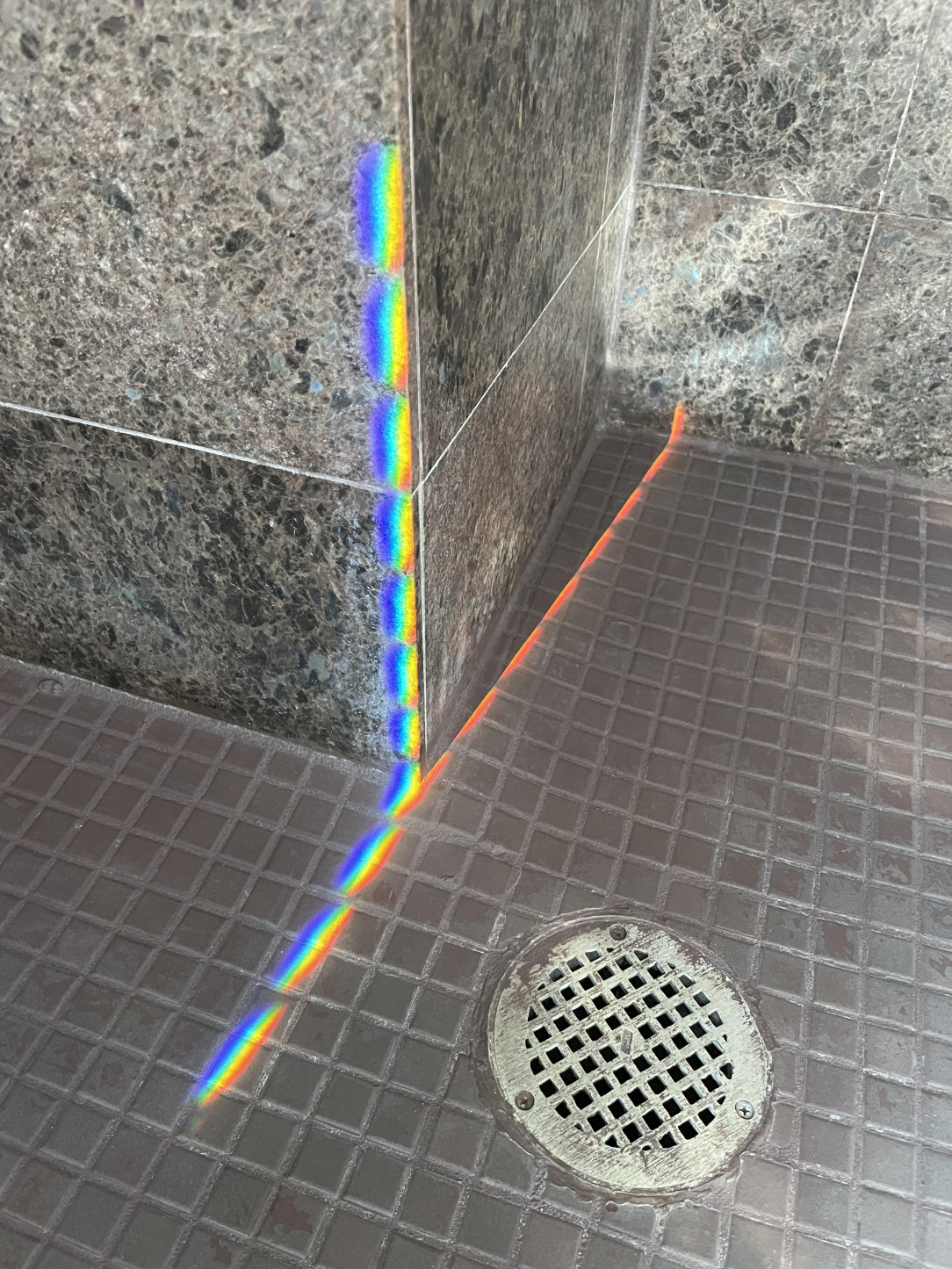 The way the spectrum is separated when the sunlight shines into this random hotel room shower