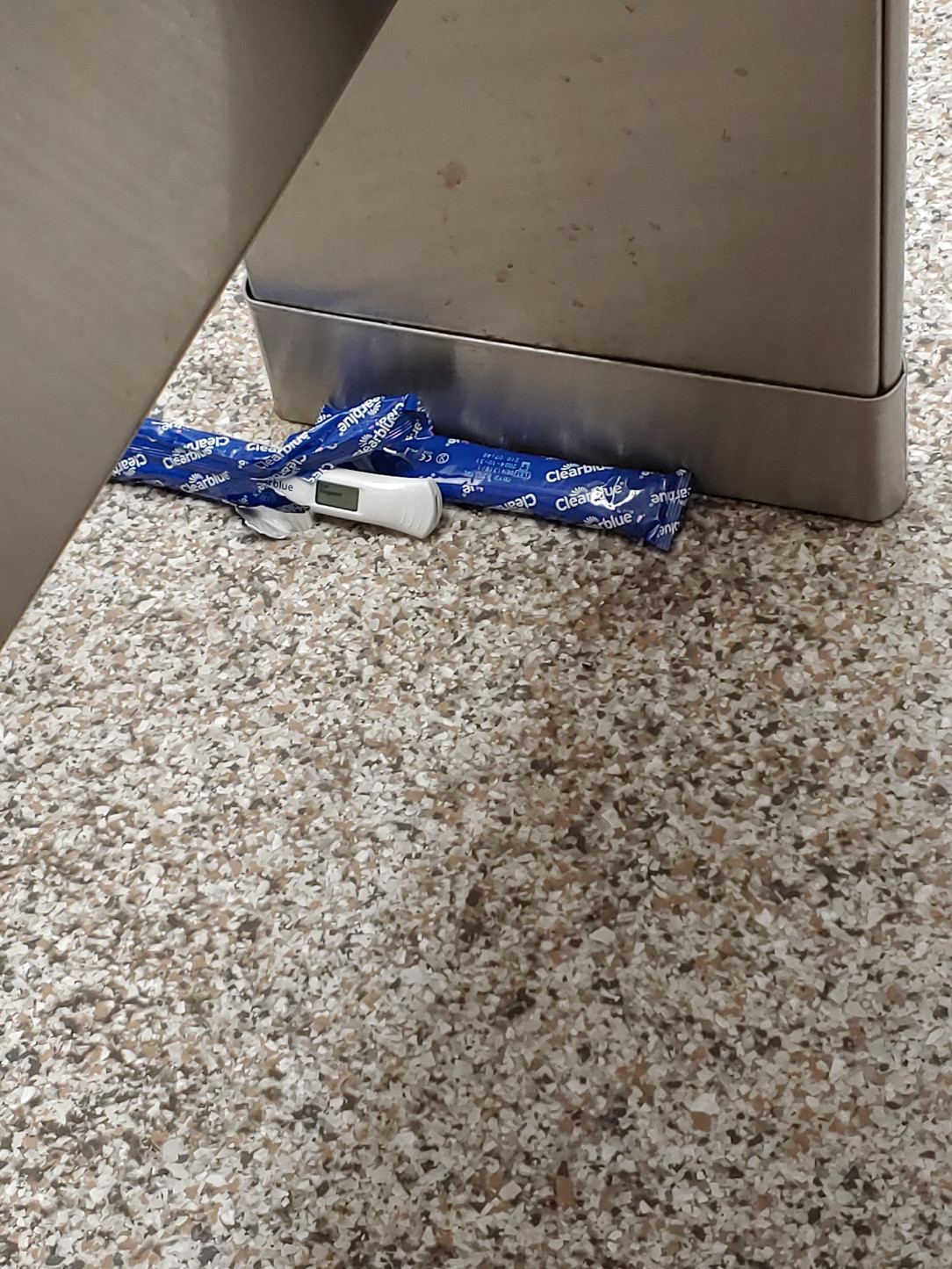 Somebody left a pregnancy test on the bathroom floor at Winn Dixie