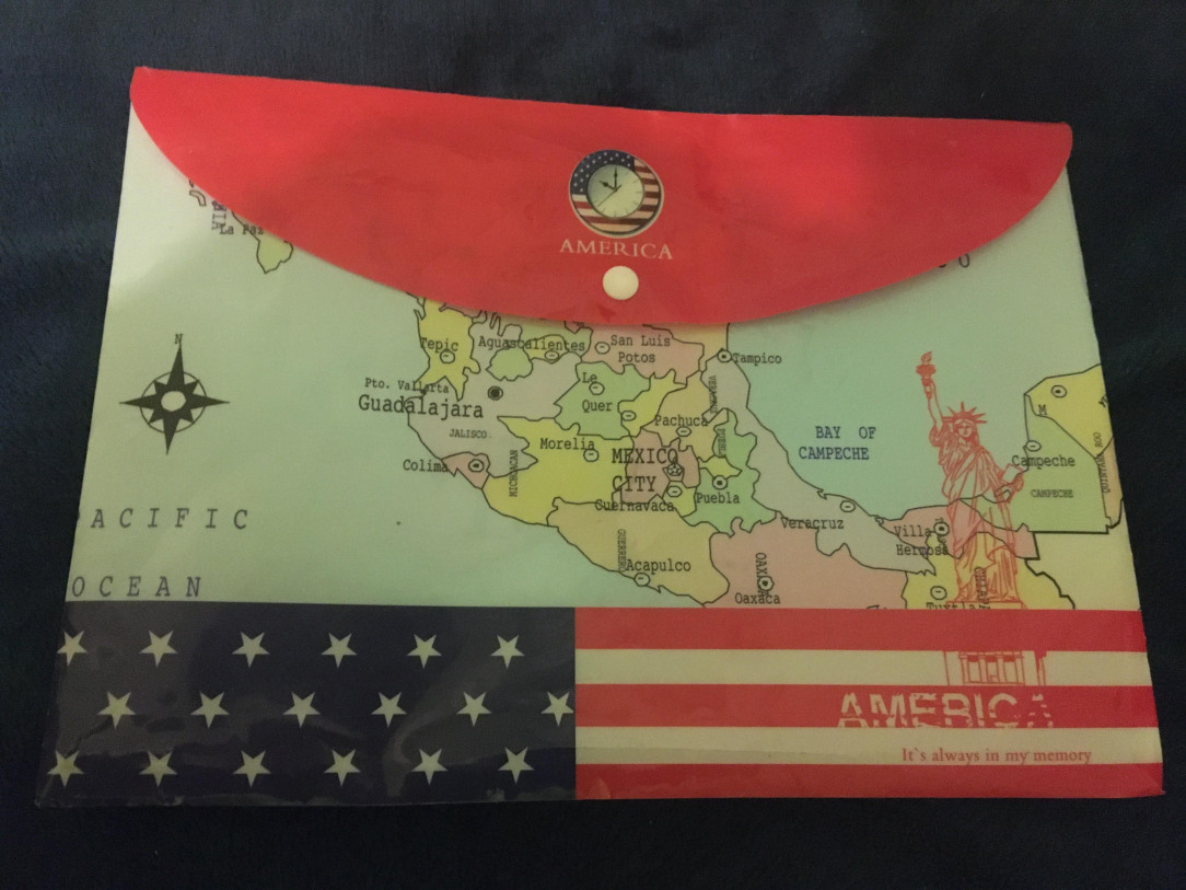 It says America, with the US flag and the Statue of Liberty, but with the map of Mexico