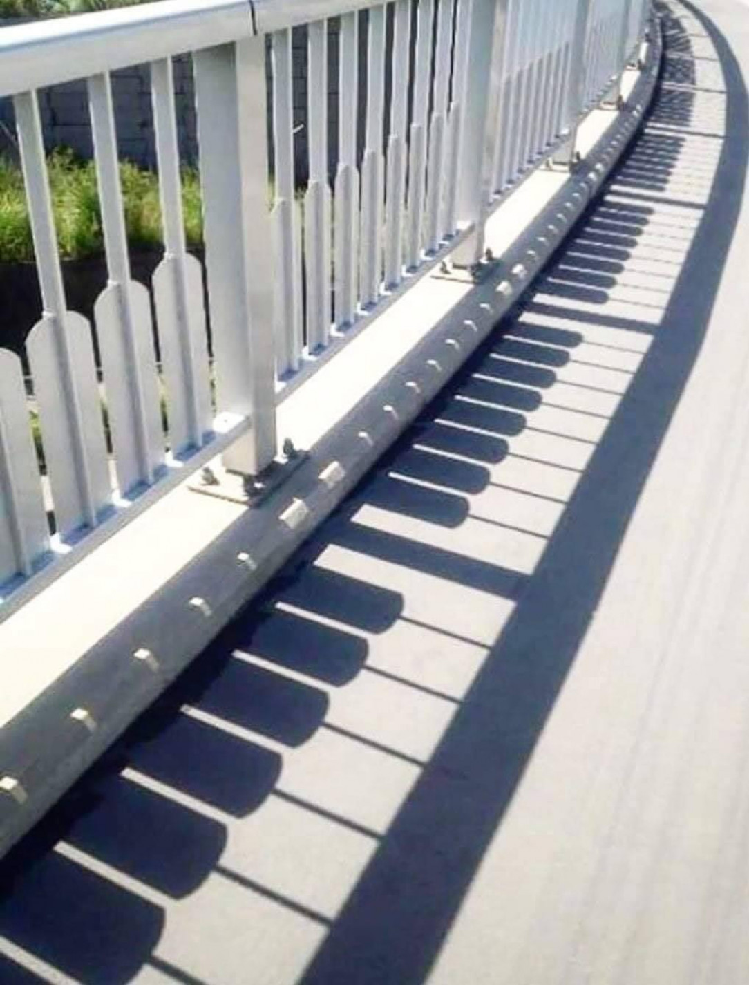 Fence shadows that look like a piano
