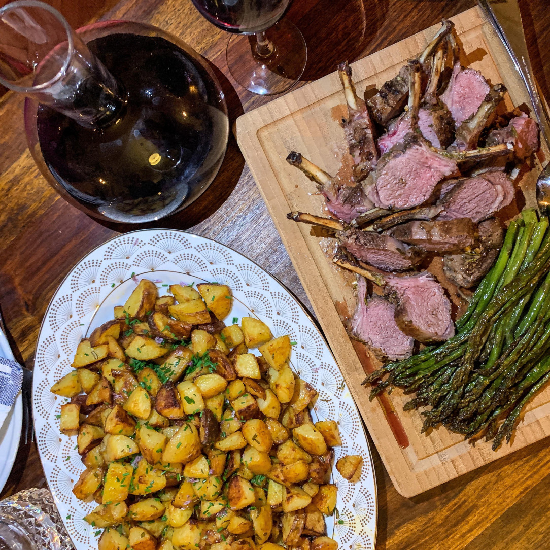 Roast lamb, potatoes, and asparagus with wine