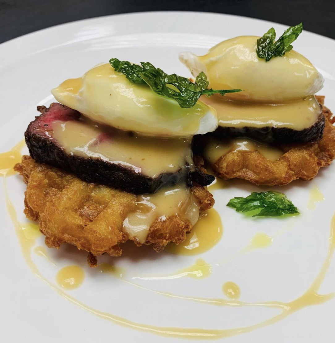 Benedict style. Crispy potato waffle, sliced flat iron steak, poached egg and hollandaise