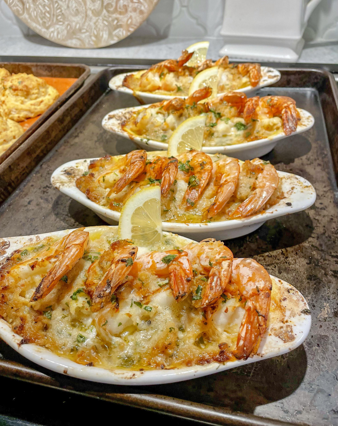 Baked shrimp scampi with crabmeat stuffing and cheddar biscuits on the side