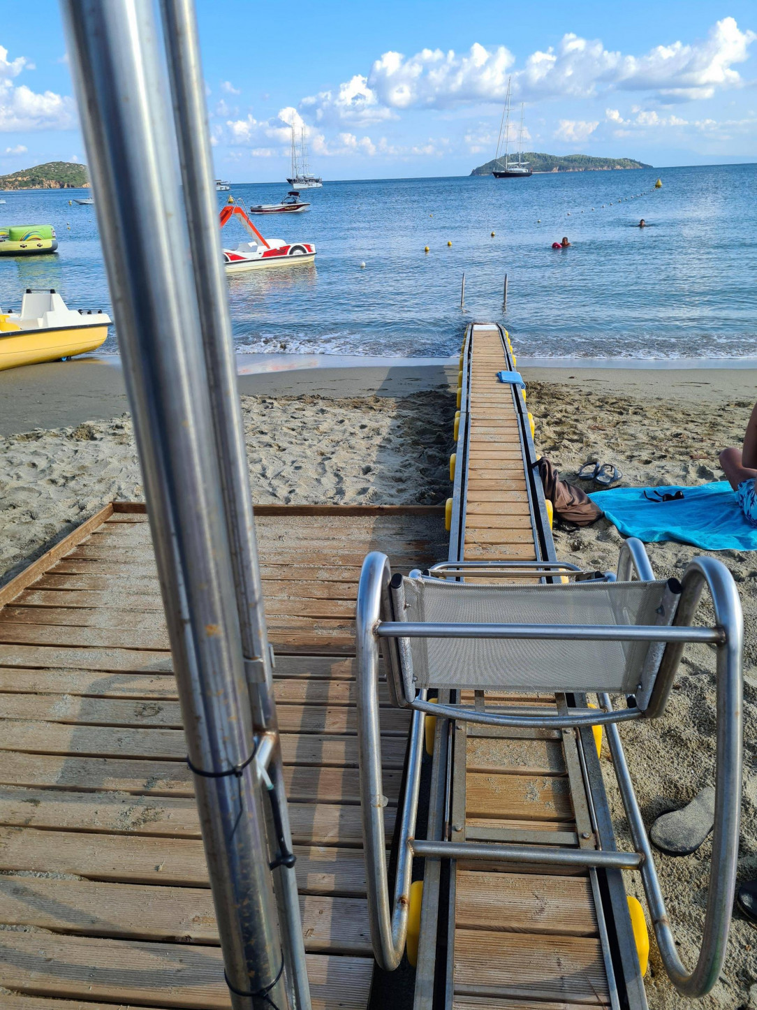 A sliding chair to help disabled people into the sea