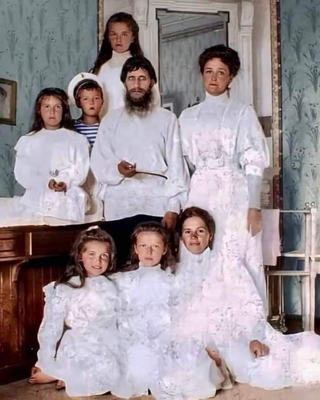 Rasputin, Tsarina Alexandra Fyodorovna, her children, and their nurse (colorized photo)