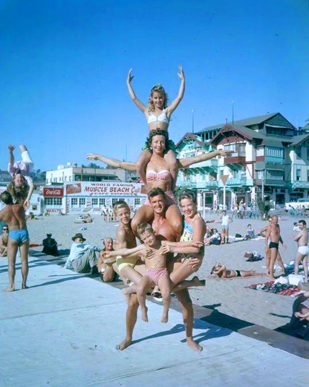 Fit family posing at Muscle Beach in California in the 1950&#039;s