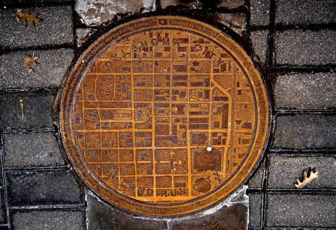 Manhole covers in Oklahoma have a city map on them with a white dot showing where you are