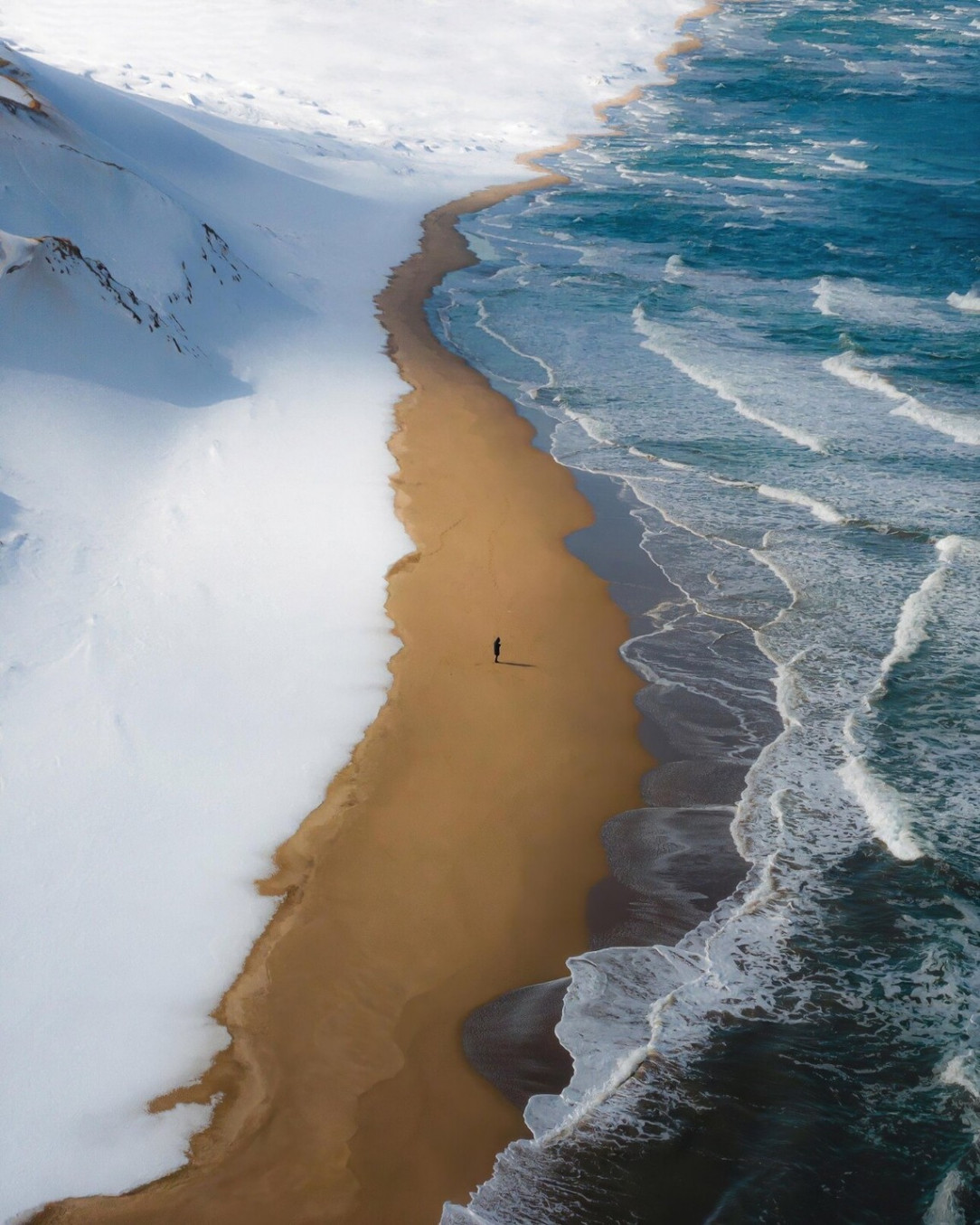 A beach in Japan where snow, sand and sea meet each other