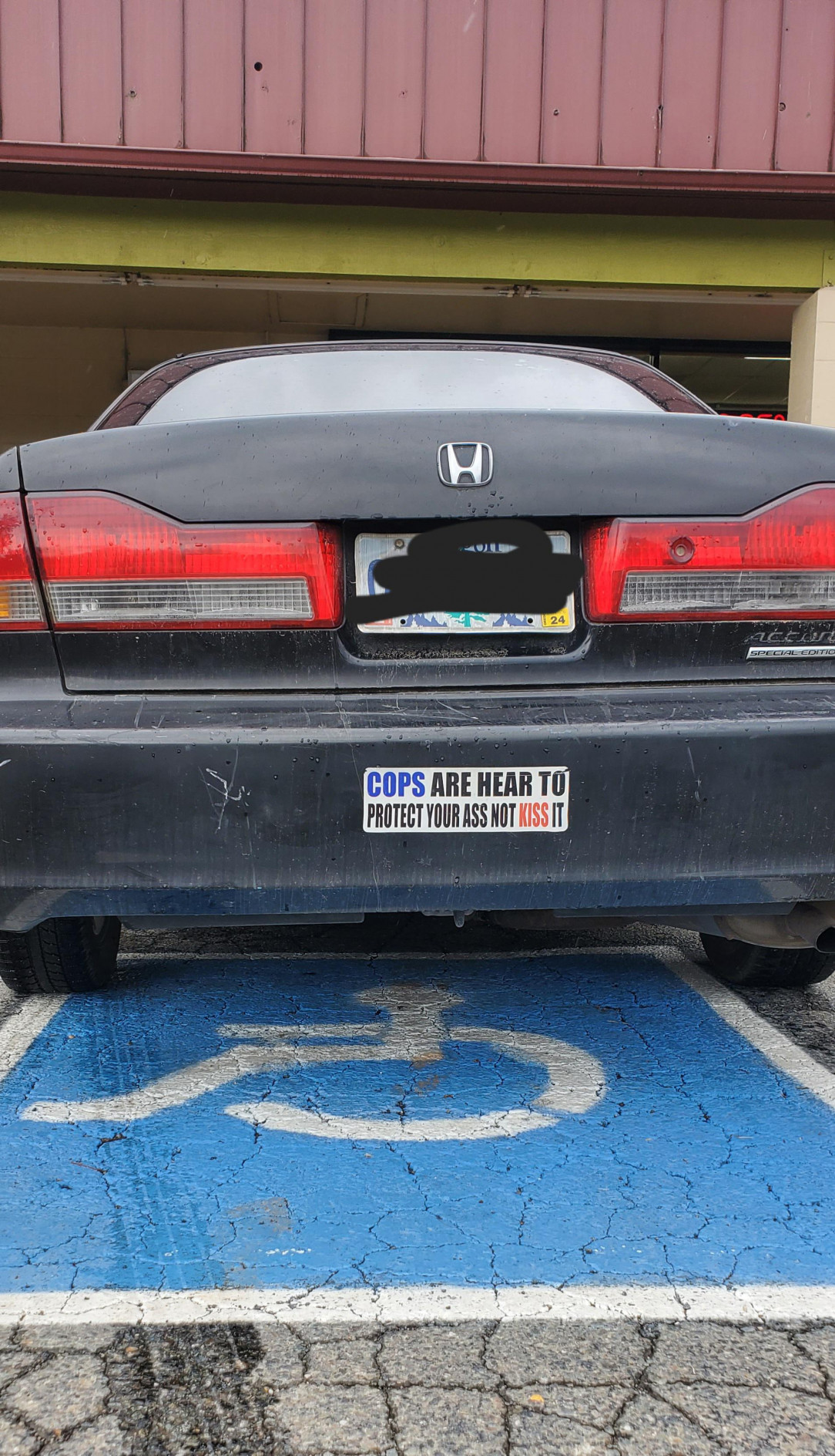 The illiterate blue line. Ironically also parked in a handicap spot with no placard