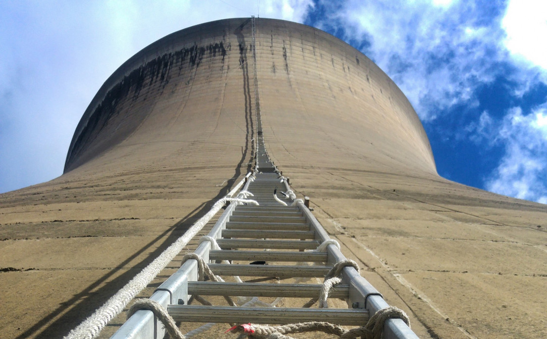 A 35 story tall nuclear cooling tower and a ladder