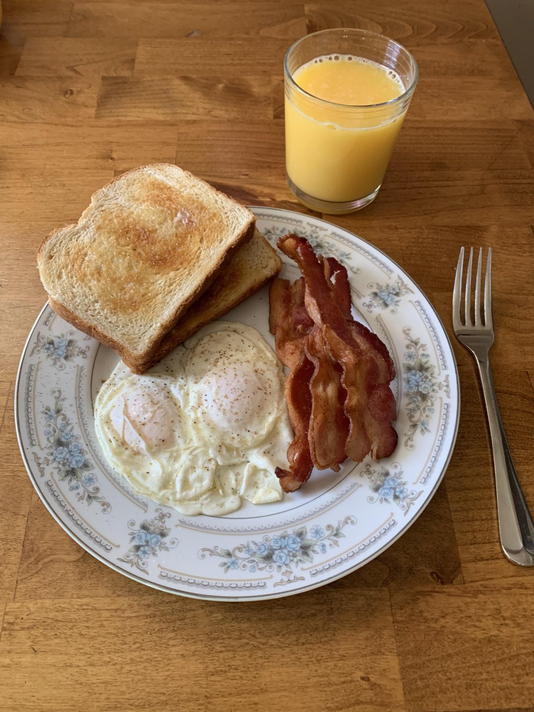 Dippy eggs, sourdough toast, and bacon