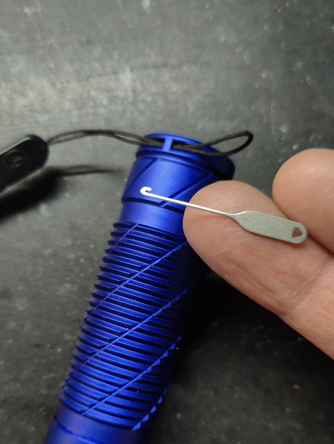 A little hook tool to pull through those tiny little straps that come with a lot of devices