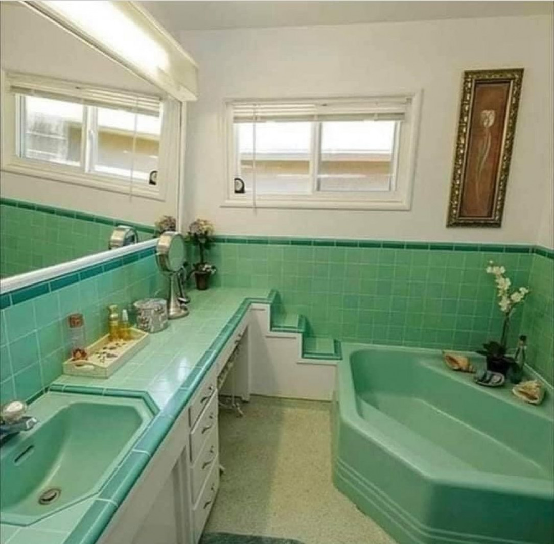 Stairs leading to window and sink
