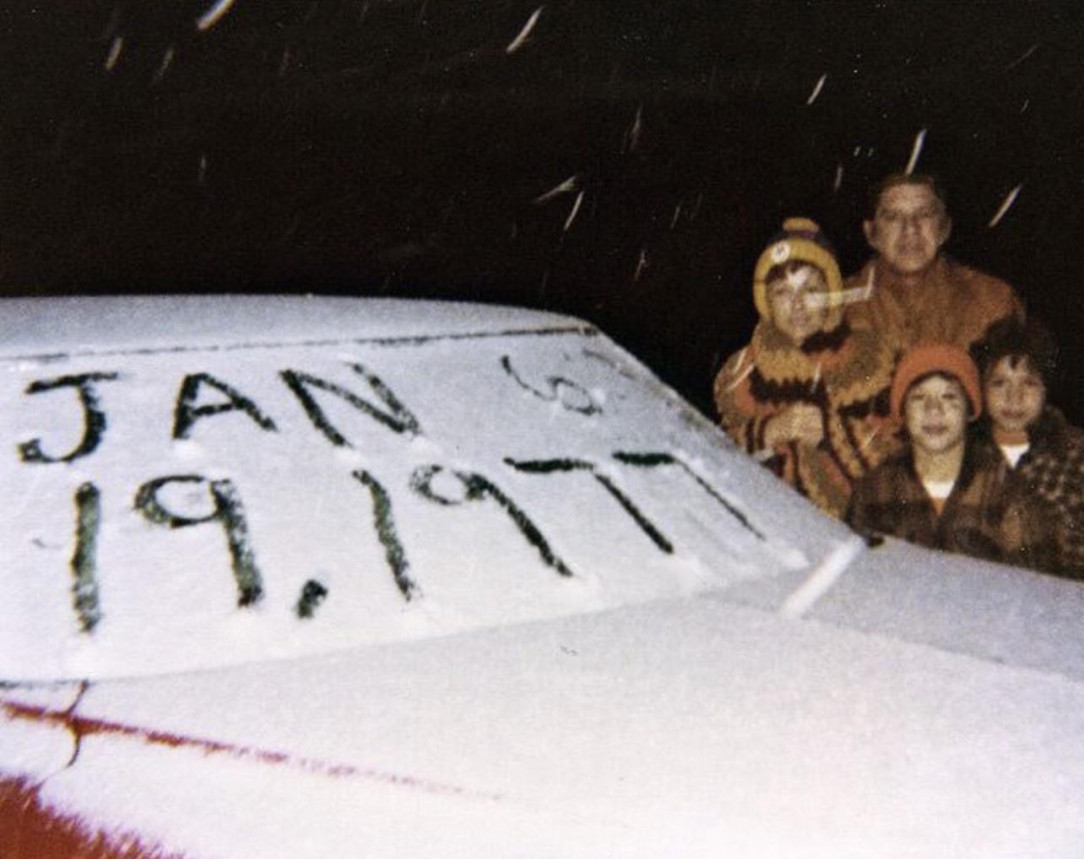 A Floridian family stands with their car during the first recorded snowfall in Southern Florida’s history, 1977