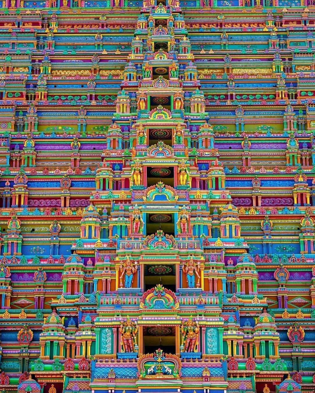 the colours and symmetry of this temple in India