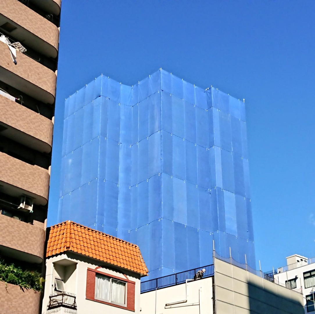 Blue tarpaulins on this construction site looking like the sky