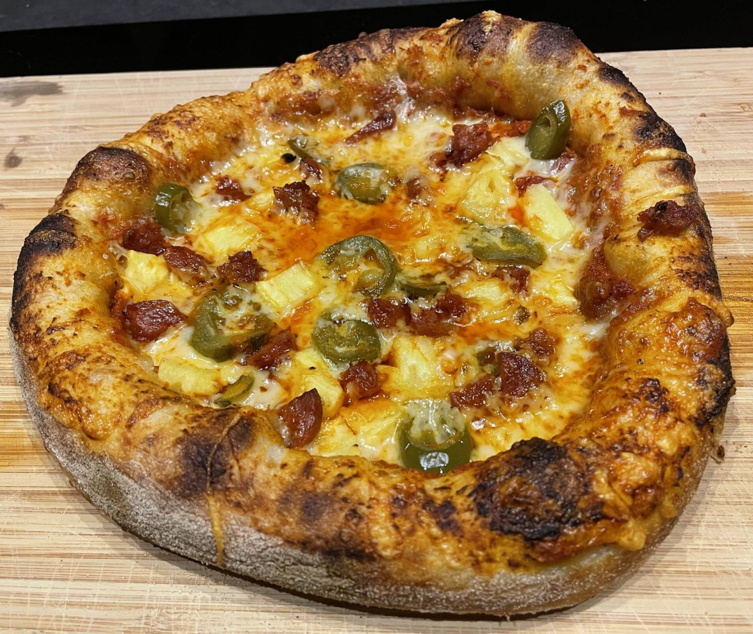 I made a pizza with chorizo, jalapeño and pineapple