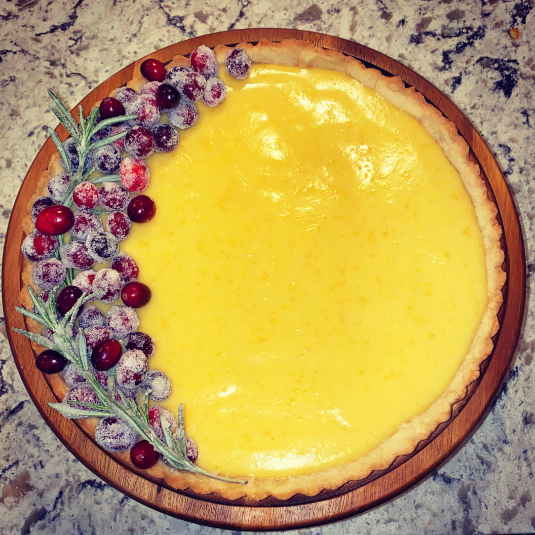 I Made an orange curd tart with candied cranberries